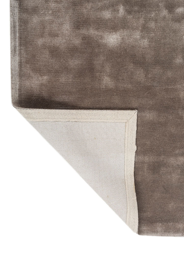 Back view of Earthy Tone Taupe Hand-Tufted Wool Rug showing durable backing and corner fold.