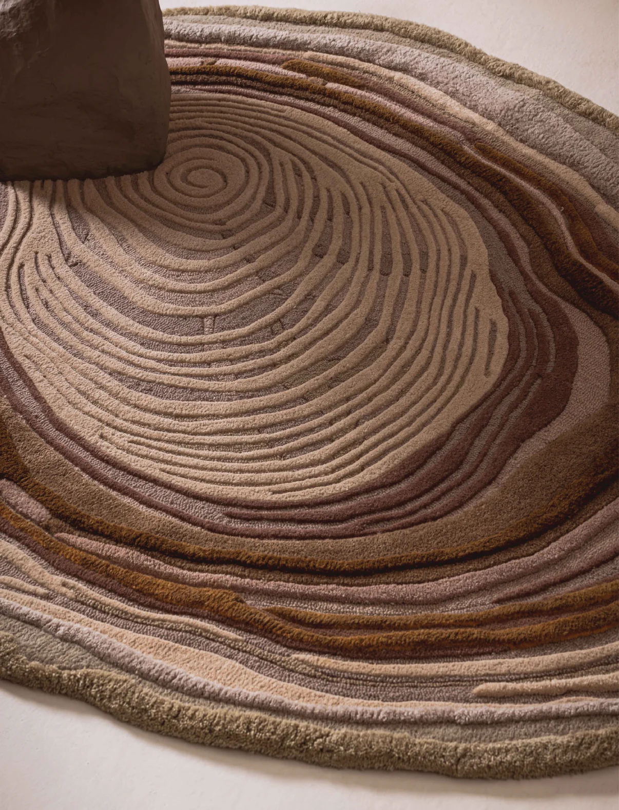 Top view of hand-tufted Sandstone Swirl Rug showing full organic ripple pattern in neutral beige and sand tones for living spaces.