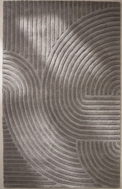 Arden Taupe hand tufted wool rug featuring curved arc pattern with textured surface and modern taupe color.