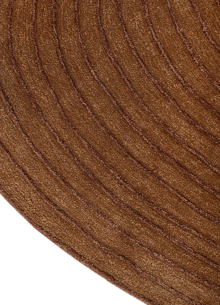 Close detail of ripple pattern on Clay Ripple Wool Rug showing carved hand tufted wool lines.