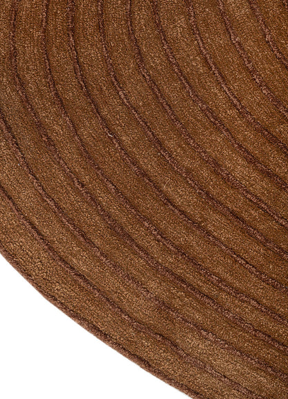 Close detail of ripple pattern on Clay Ripple Wool Rug showing carved hand tufted wool lines.