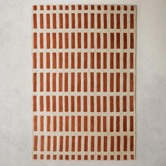 Full view of Gridline Terra Wool Rug hand tufted wool rug with warm terracotta grid pattern.