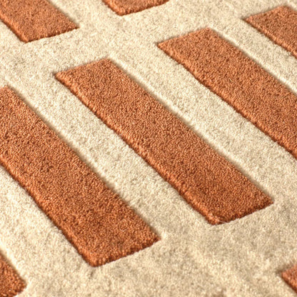 Close up texture of Gridline Terra Wool Rug hand tufted wool rug showing raised grid lines.