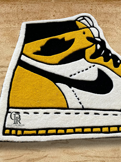 Close-up of Air Jordan Yellow Hand-Tufted Rug showing fine tufting, smooth curves, and vibrant sneaker colors.