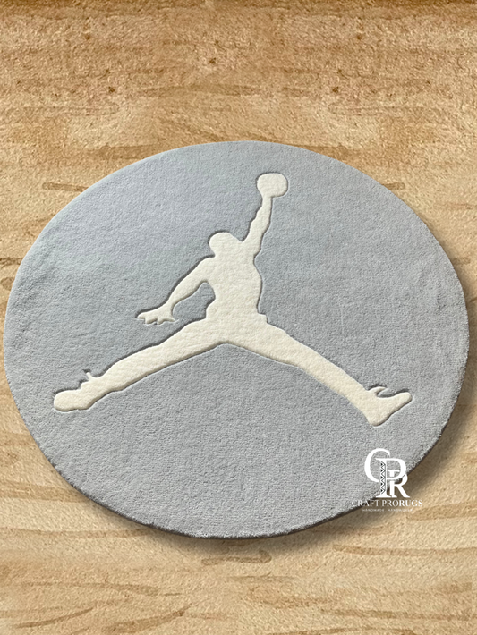 Athlete silhouette round hand-tufted rug featuring a jumping sports figure design, ideal for modern rooms and sports décor
