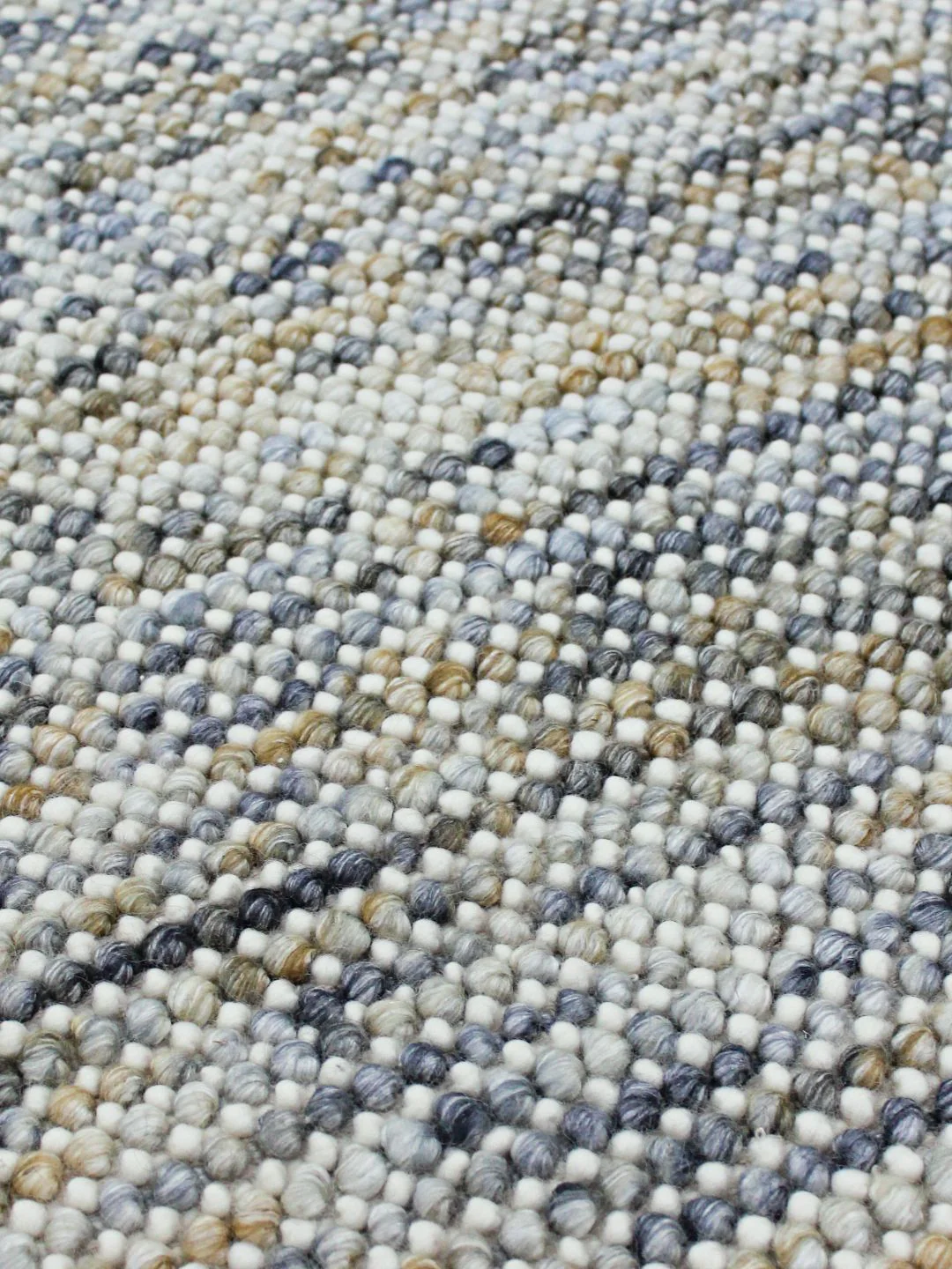 Close-up of Chalkstone Pebble flatweave rug highlighting detailed weave texture, subtle chalk tones, and pebble-inspired design
