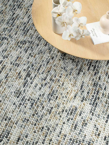 Top view of Chalkstone Pebble flatweave rug showing soft neutral chalk tones and textured pebble-inspired design