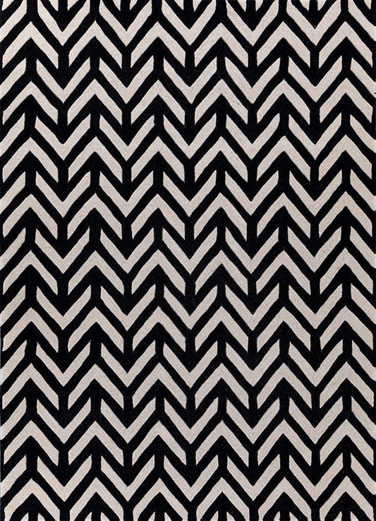 Hand tufted wool rug with black and ivory chevron pattern, modern zigzag design suitable for living room interiors.
