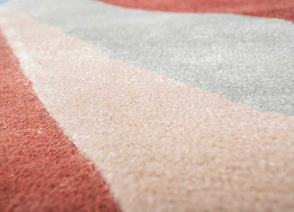 Side view of Color Axis Wool Rug displaying colorful geometric design in a contemporary home setting. 