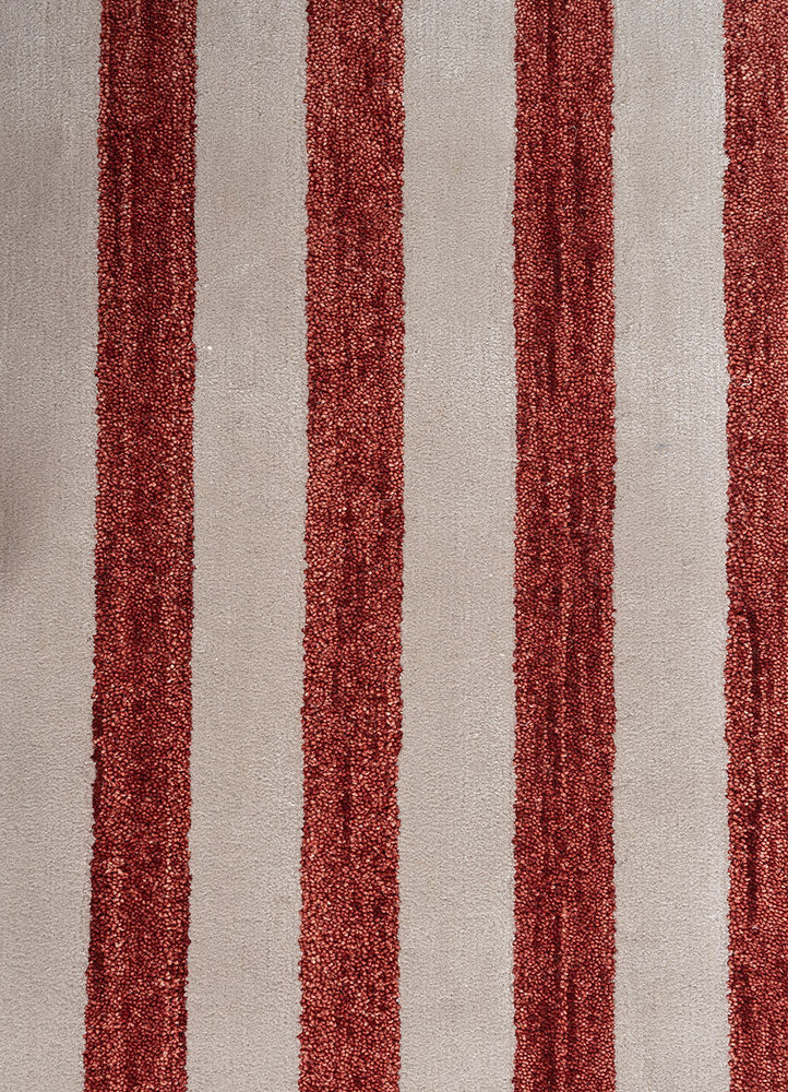 Border detail of Crimson Rhythm Striped hand tufted wool rug with contrasting dark edges and crisp vertical stripe design.