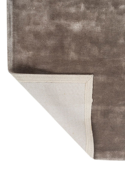 Back view of Earthy Tone Taupe Hand-Tufted Wool Rug showing durable backing and corner fold.