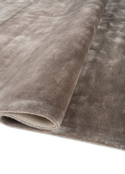 Rolled corner of Earthy Tone Taupe Hand-Tufted Wool Rug highlighting plush wool pile and craftsmanship.
