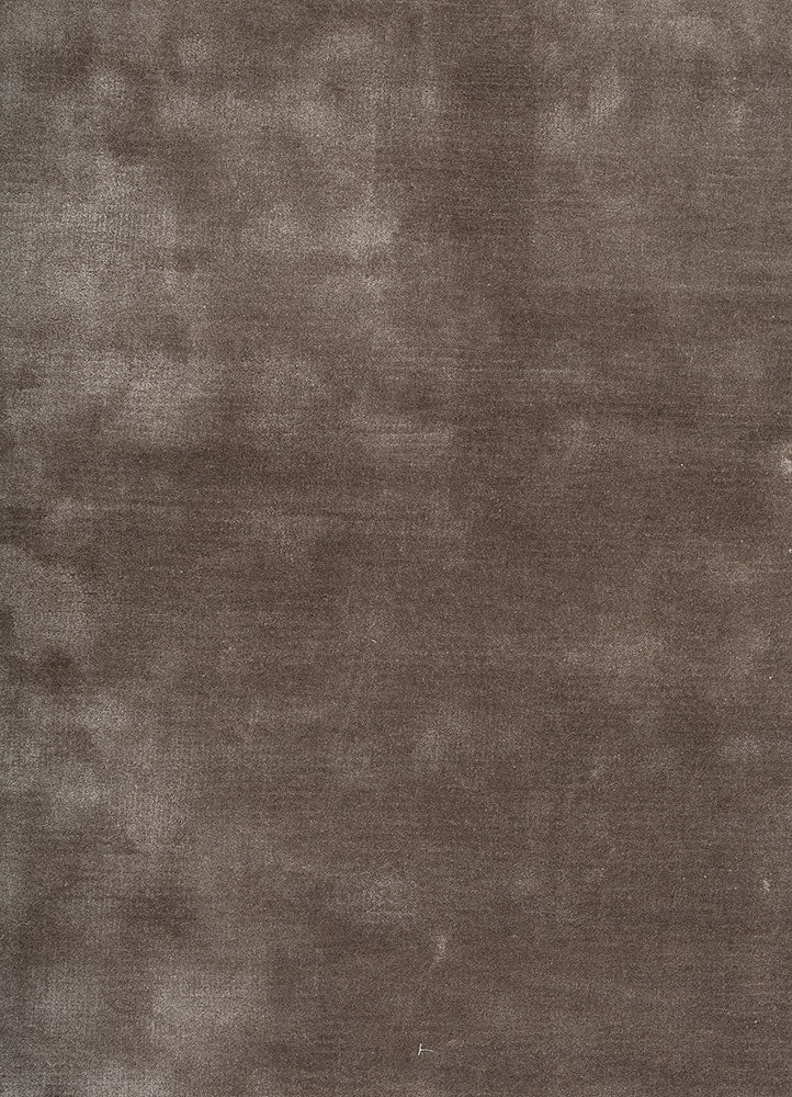 Close-up of Earthy Tone Taupe Hand-Tufted Wool Rug showing soft tactile texture and tonal variations.