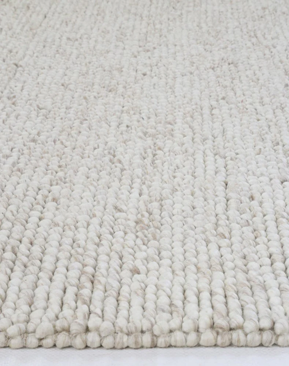 Close-up of flatweave Nirvana Chalk Pebbles rug showing detailed woven texture and subtle chalk pebble design