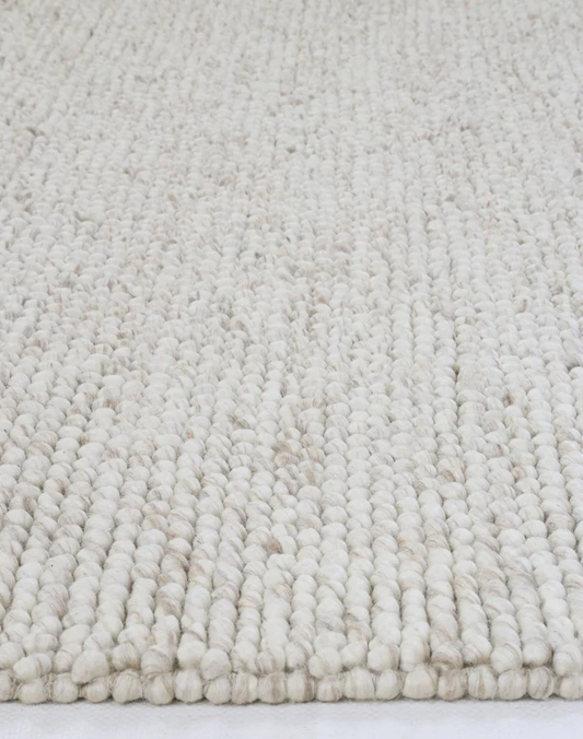Close-up of flatweave Nirvana Chalk Pebbles rug showing detailed woven texture and subtle chalk pebble design