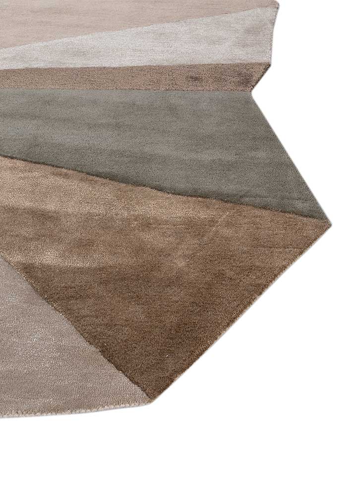 Angled view of geometric spectrum hand-tufted wool rug displaying sharp geometric edges and smooth wool surface finish