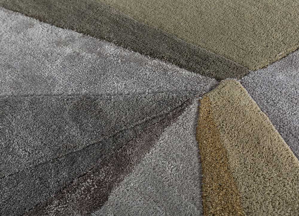 Detailed view of geometric spectrum hand-tufted wool rug highlighting abstract color blocks and clean modern pattern design.