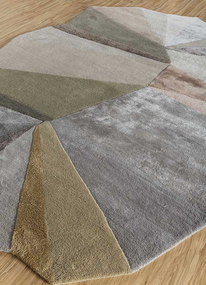 Close-up of geometric spectrum hand-tufted wool rug showing dense pile texture, premium wool yarn, and fine tufting detail