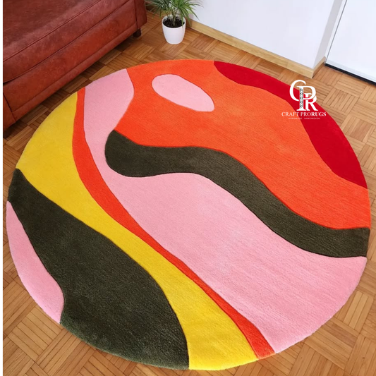 Hand-tufted Round Pop Rug in vibrant pink, orange, yellow, red, olive, and dark brown, top view showing full design