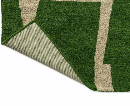 Back fold view of Moqui Green hand tufted wool rug showing flexibility and durable hand tufted wool backing.