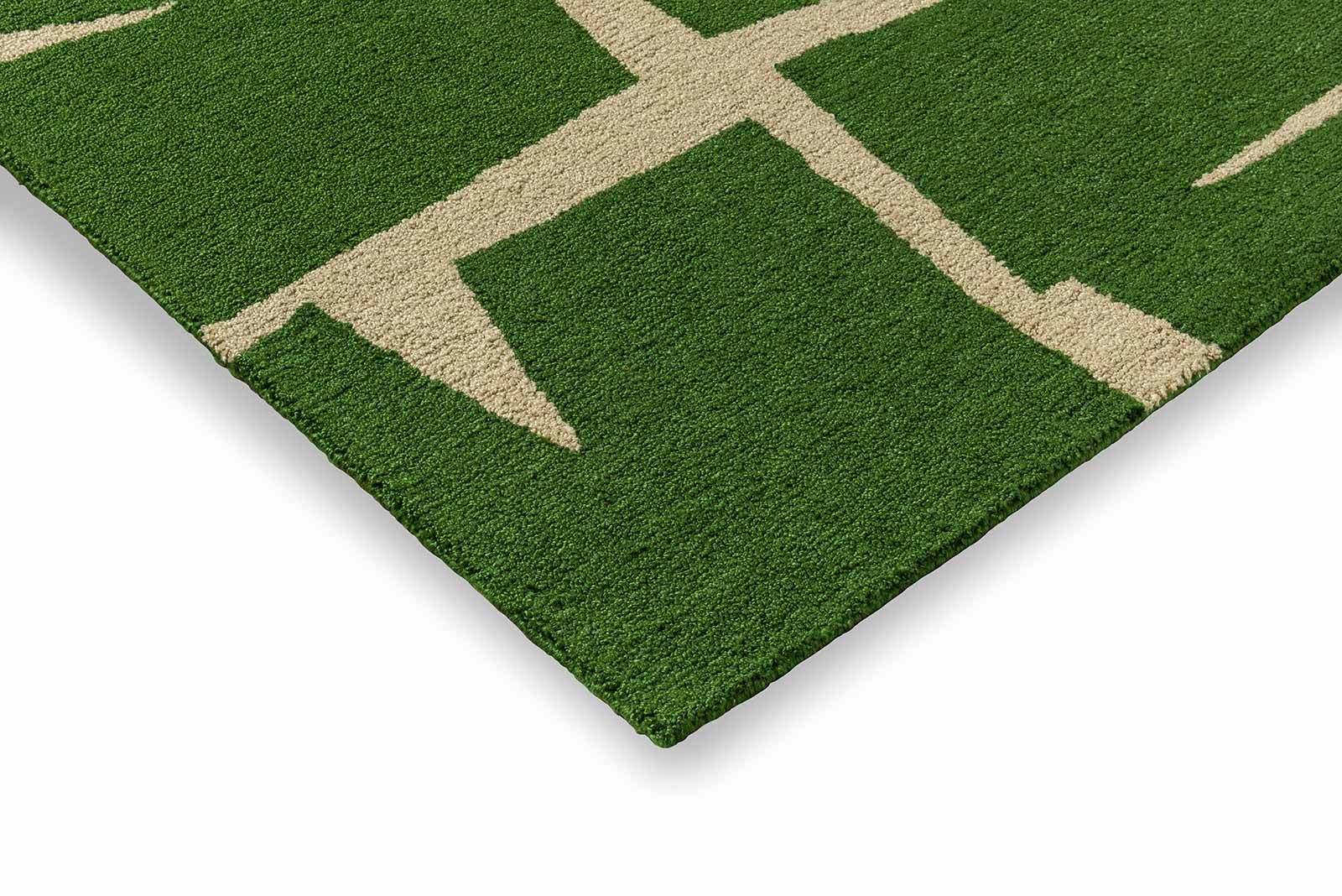 Corner detail of Moqui Green hand tufted wool rug highlighting clean edges thickness and premium wool construction.