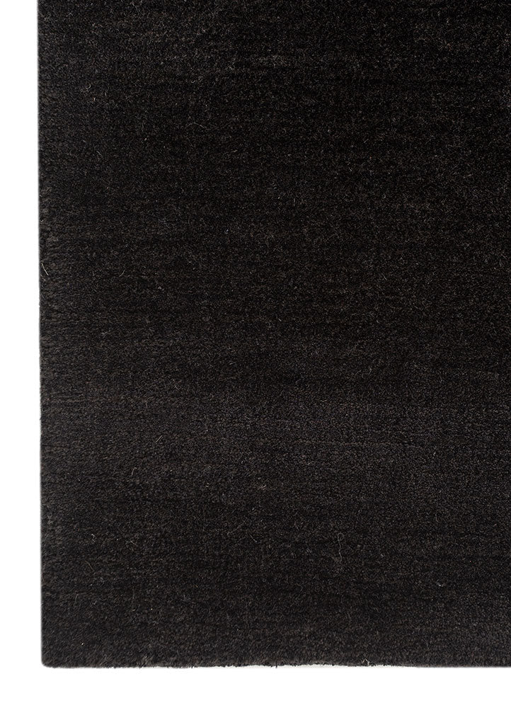 Black base texture detail of Obsidian modern abstract wool rug.