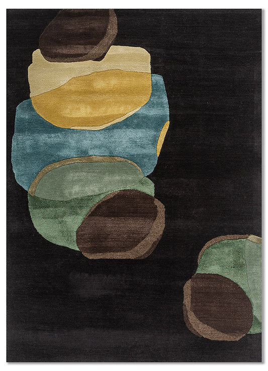 Obsidian modern abstract wool rug with earthy shapes on a black background.