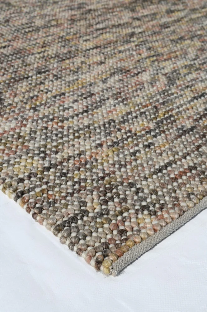 Corner view of Pebbles Magic Multi Grey flatweave rug showing geometric pattern, texture, and detailed flatweave craftsmanship