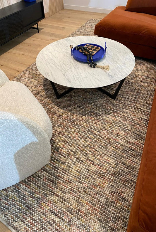 Top-angle view of Pebbles Magic Multi Grey flatweave rug showing full geometric pattern, texture, and modern room placement