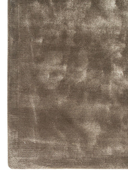 Flat surface view of hand tufted wool rug featuring even texture and calm taupe finish.