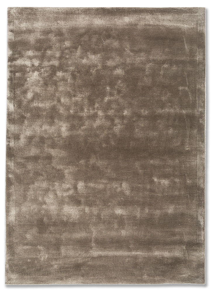 Hand tufted wool rug in soft taupe shade with smooth texture and minimal design, ideal for modern living spaces.