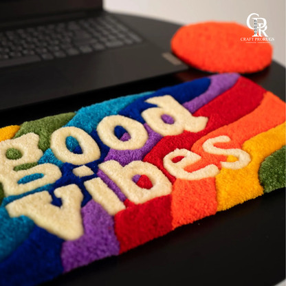 Vibe Stripe Keyboard Rug side angle view highlighting soft texture colorful stripes and raised tufted good vibes lettering